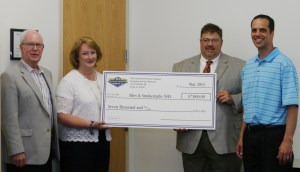 Farm owners Benjamin and Lisa Riensche formally presented a check to SSNHA Chairman Troy Louwagie and President Don Short.