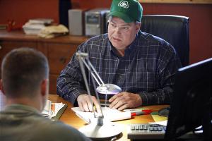 Farmer Ben Riensche, right, talks with Pioneer account manager Brandon Moe, left, on his farm near Jesup, Iowa. Even in a recession, people need to eat. And right now that's a saving grace for chemical companies with agricultural businesses.